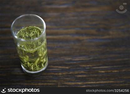 Leaves in a glass on the table