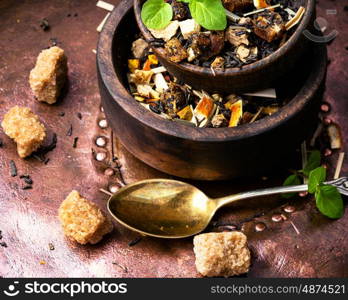 leaves of fruit tea. mix of fruit tea leaf in a wooden bowl