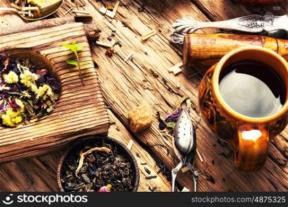 leaves of herbal tea. Set of healthy tea leaf in a wooden bowl.Food background tea theme