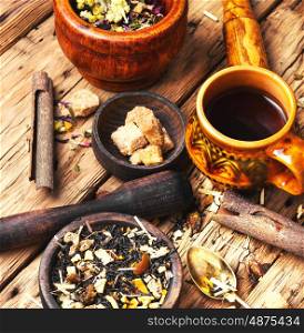 leaves of herbal tea. Set of healthy tea leaf in a wooden bowl.Food background tea theme