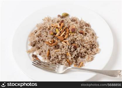 Lebanese spiced rice with minced beef and garnished with freshly toasted nuts