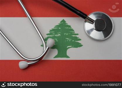 Lebanon flag and stethoscope. The concept of medicine. Stethoscope on the flag as a background.. Lebanon flag and stethoscope. The concept of medicine.