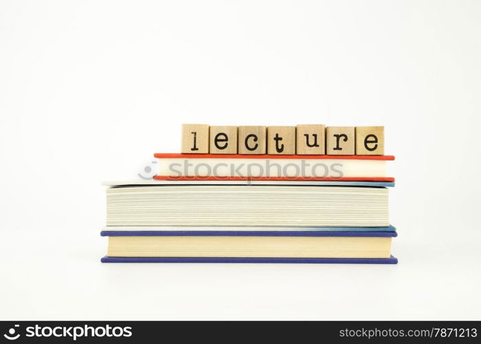 lecture word on wood stamps stack on books, knowledge and academic concept