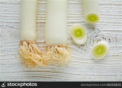 Leeks vegetable raw food with cutted texture in a white wood board table