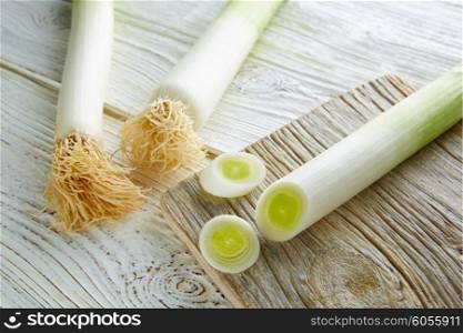 Leeks vegetable raw food with cutted texture in a white wood board table
