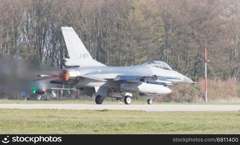 LEEUWARDEN, NETHERLANDS - APRIL 11, 2016: A dutch F-16 on the ground during the exercise Frisian Flag. The exercise is considered one of the most important NATO training events this year.