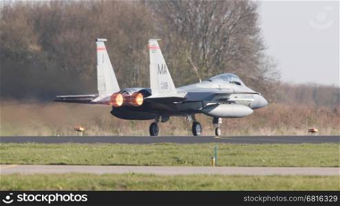 LEEUWARDEN, NETHERLANDS - APRIL 11, 2016: US Air Force F-15 Eagle takking off during the exercise Frisian Flag. The exercise is considered one of the most important NATO training events this year.