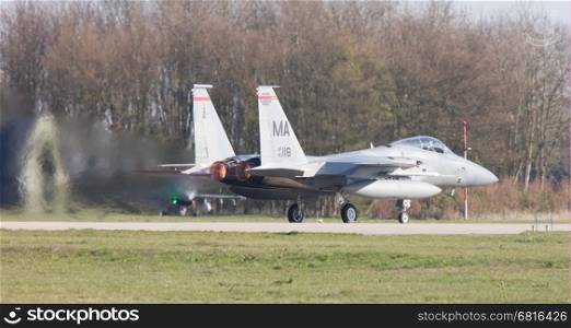 LEEUWARDEN, NETHERLANDS - APRIL 11, 2016: US Air Force F-15 Eagle takking off during the exercise Frisian Flag. The exercise is considered one of the most important NATO training events this year.