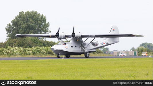 LEEUWARDEN, NETHERLANDS - JUNE 10: Consolidated PBY Catalina in Dutch Navy colors flying at the Royal Netherlands Air Force Days June 10, 2016 in Leeuwarden, Netherlands.