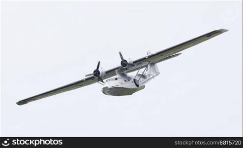 LEEUWARDEN, NETHERLANDS - JUNE 10: Consolidated PBY Catalina in Dutch Navy colors flying at the Royal Netherlands Air Force Days June 10, 2016 in Leeuwarden, Netherlands.
