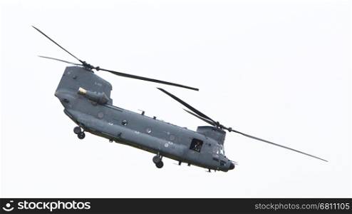 LEEUWARDEN, NETHERLANDS - JUNI 11 2016: Chinook CH-47 military helicopter in action during a demonstration flight on juni 11 , 2016 in Leeuwarden