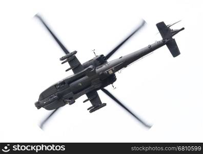 LEEUWARDEN, THE NETHERLANDS - JUN 11, 2016: Boeing AH-64 Apache attack helicopter flying a demo during the Royal Netherlands Air Force Days