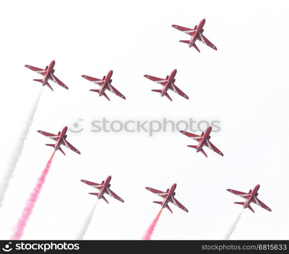 LEEUWARDEN, THE NETHERLANDS - JUNE 10, 2016: RAF Red Arrows performing at the Dutch Air Force Open House on June 10, 2016 at Leeuwarden Airfield, The Netherlands.