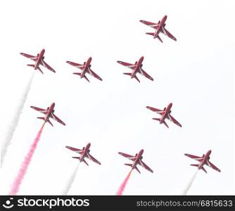 LEEUWARDEN, THE NETHERLANDS - JUNE 10, 2016: RAF Red Arrows performing at the Dutch Air Force Open House on June 10, 2016 at Leeuwarden Airfield, The Netherlands.