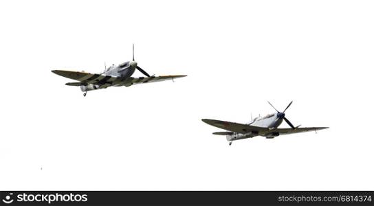 LEEUWARDEN, THE NETHERLANDS - JUNE 10, 2016: Vintage Spitfire fighter planes making a low flypast for the public at the Royal Netherlands Air Force Days at Leeuwarden on June 10, 2016.
