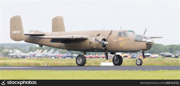 LEEUWARDEN, THE NETHERLANDS - JUNE 10: WW2 B-25 Mitchell bomber in Dutch markings take off during the Dutch Air Force Open House. June 10, 2016 in Gilze-Rijen, The Netherlands