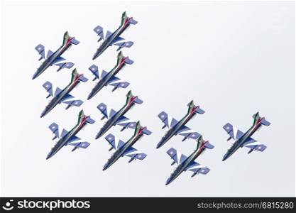 LEEUWARDEN, THE NETHERLANDS-JUNE 11, 2016: Italian aerobatic team Frecce Tricolori (Tricolor arrows) performs a show at the Dutch Airshow on June 11, 2016 at Leeuwarden Airfield, The Netherlands.