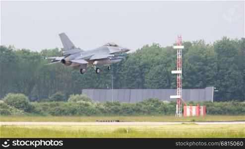 LEEUWARDEN, THE NETHERLANDS -MAY 26: F-16 fighter during a comparisontest with a F-35 in Europe on May 26, 2016 in Leeuwarden. The F-35 will replace the F-16 in the Netherlands.