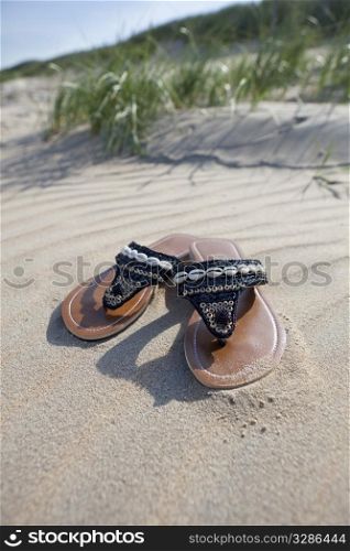 Left slippers on the beach