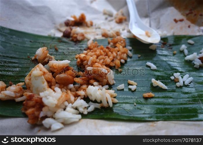 Leftover rice on banana leave. Food wasting concept