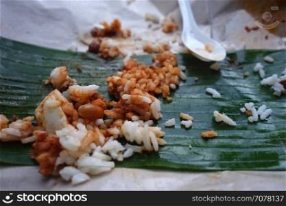 Leftover rice on banana leave. Food wasting concept