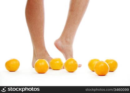 leg and oranges isolated white background