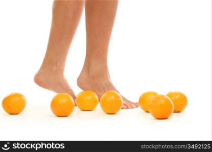 leg and oranges isolated white background