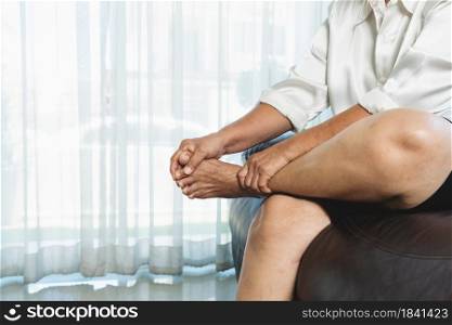 leg cramp, senior woman suffering from leg cramp pain at home, health problem concept