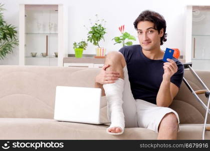 Leg injured young man suffering at home 