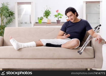 Leg injured young man suffering at home