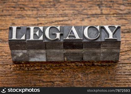 legacy word in mixed vintage metal type printing blocks over grunge wood