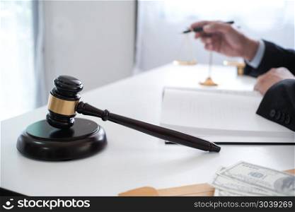 Legal counsel presents to the client a signed contract with gave. Legal counsel presents to the client a signed contract with gavel and legal law. justice and lawyer concept