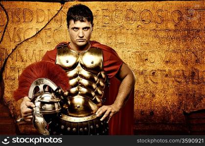 Legionary soldier in front of roman wall