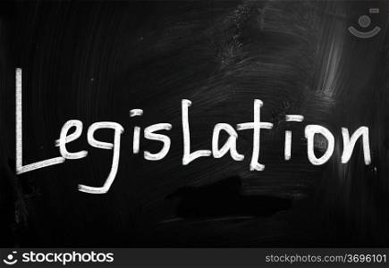 ""Legislation" handwritten with white chalk on a blackboard"