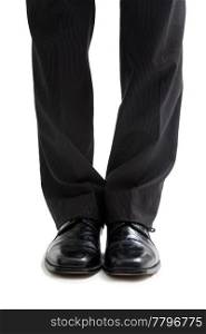 Legs and feet of a business man in black pants and dress shoes, isolated