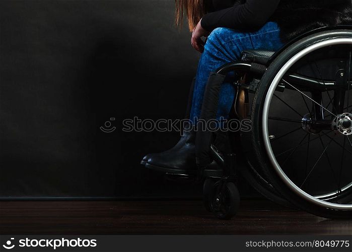 Legs of disabled person.. Disease disability paralysis handicap health concept. Legs of disabled person. Crippled female sitting on wheelchair.