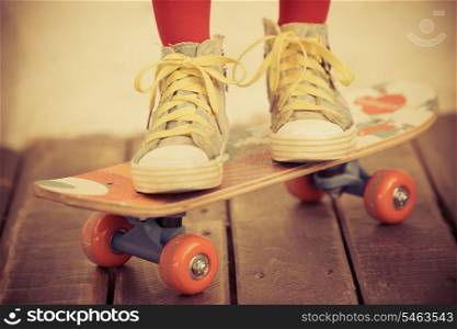 Legs of skateboarder. Closeup view
