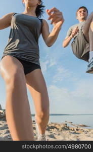 Legs View Of A Couple Jogging Outdoor on the Beach