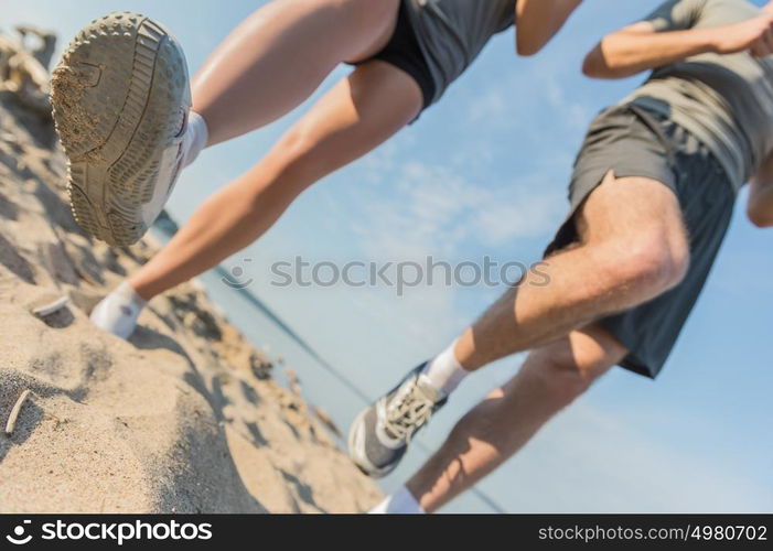 Legs View Of A Couple Jogging Outdoor on the Beach