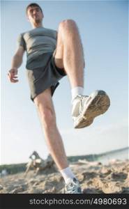 Legs View Of A Man Jogging Outdoor on the Beach