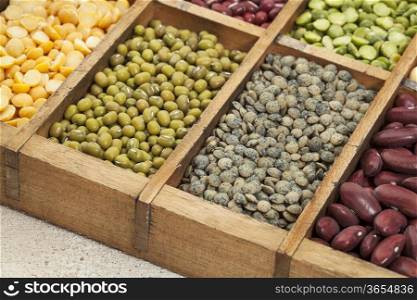 legumes in box abstract with a selective focus on French green lentil