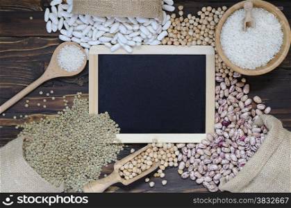 Legumes on wooden table in the kitchen