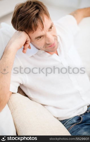 leisure and happiness concept - middle-aged man at home