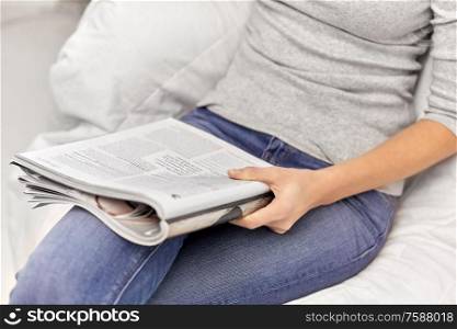 leisure and people concept - close up of woman reading magazine at home. close up of woman reading magazine at home