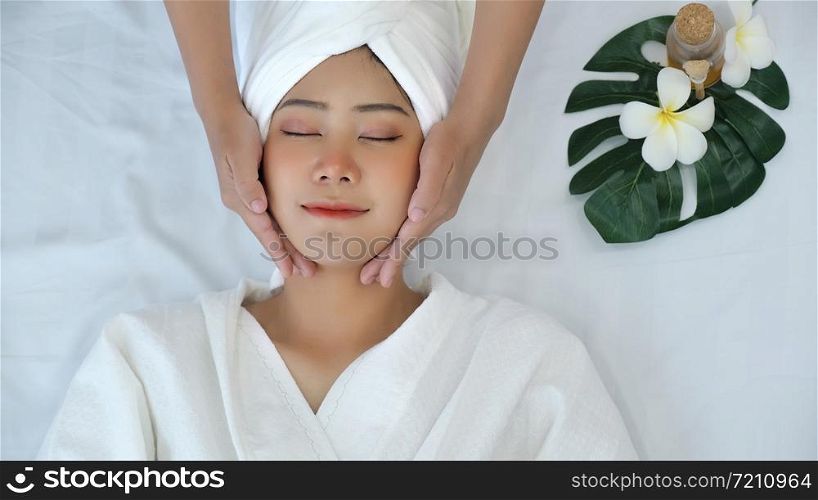 Leisure asian young woman in spa salon. Massage and treatment spa room.