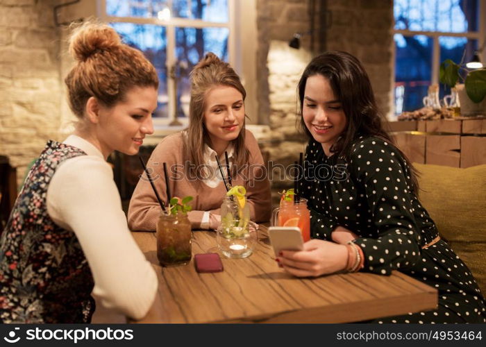 leisure, celebration, party, people and holidays concept - happy friends with drinks at restaurant. happy friends with drinks at restaurant