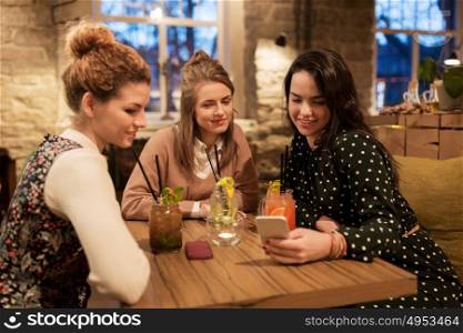 leisure, celebration, party, people and holidays concept - happy friends with drinks at restaurant. happy friends with drinks at restaurant