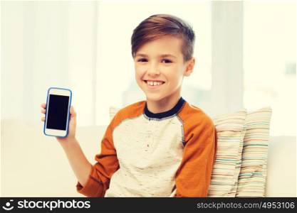 leisure, children, technology, advertisement and people concept - smiling boy with smartphone at home. smiling boy with smartphone at home