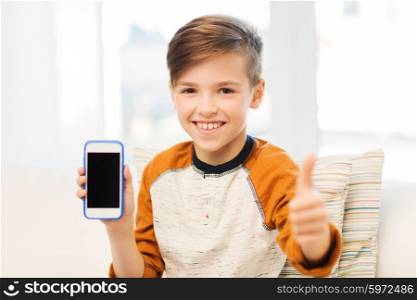 leisure, children, technology, advertisement and people concept - smiling boy with smartphone at home