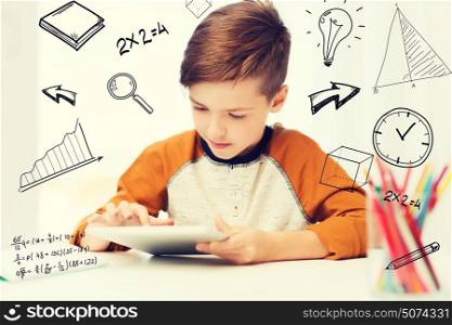 leisure, children, technology and people concept - close up of boy with tablet pc computer at home over mathematical doodles. close up of boy with tablet pc computer at home